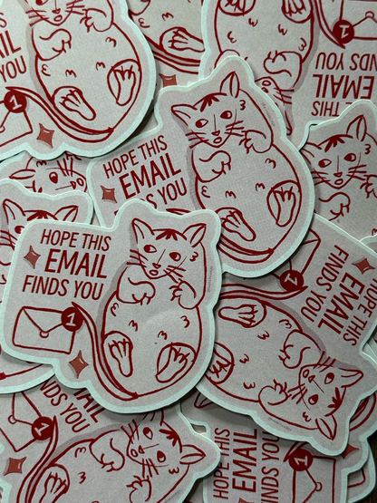 A pile of die-cut stickers featuring a red line-art cat sitting next to a red email icon and the text 'HOPE THIS EMAIL FINDS YOU'