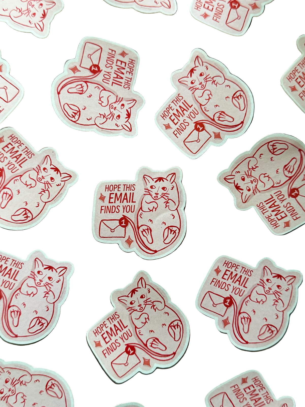 A collection of white die-cut stickers featuring a red line-art illustration of a cat with an envelope and the text 'HOPE THIS EMAIL FINDS YOU'
