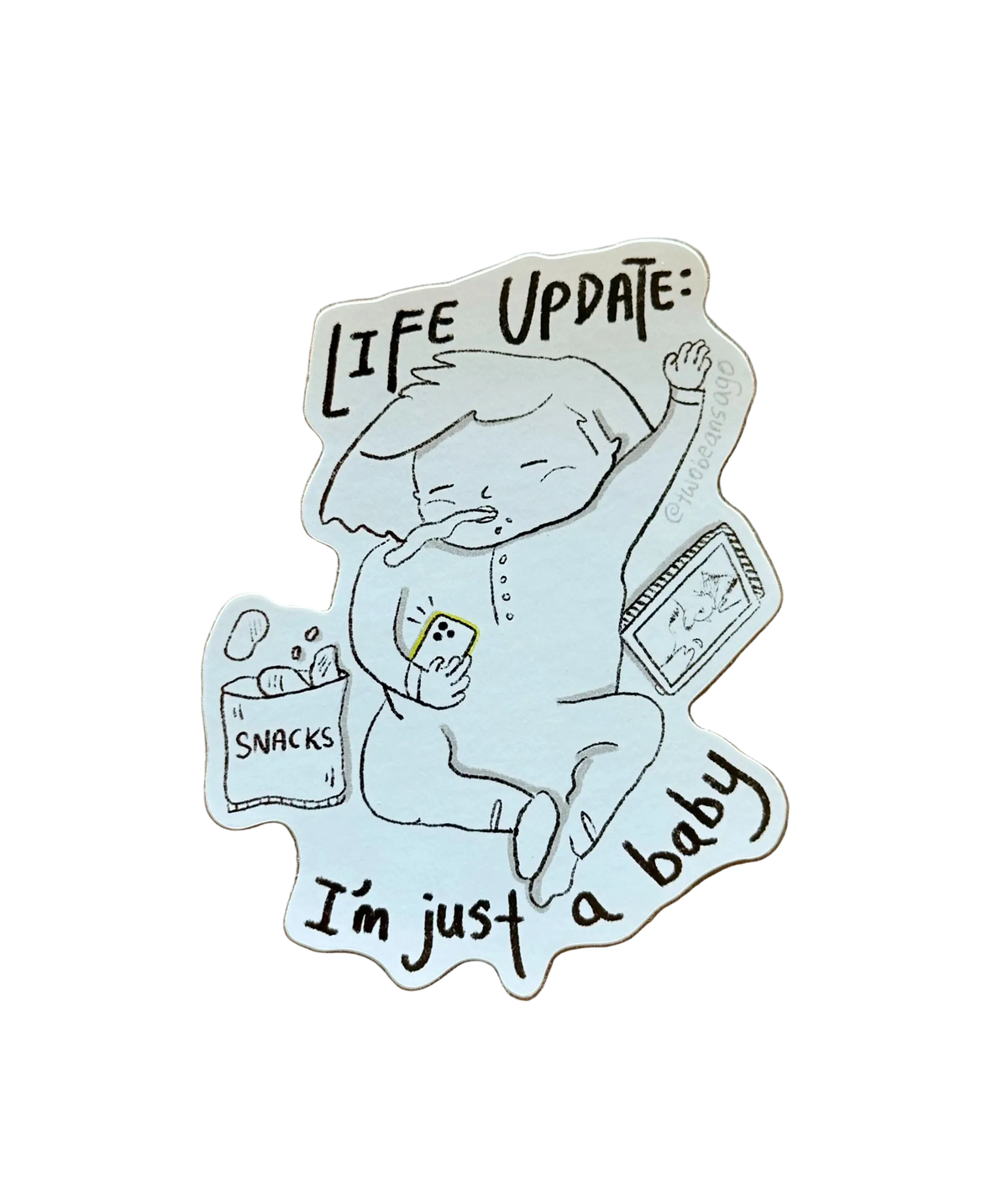 A die-cut sticker featuring a hand-drawn baby character with the text 'LIFE UPDATE: I'm just a baby' and small snack illustrations with an iPad.
