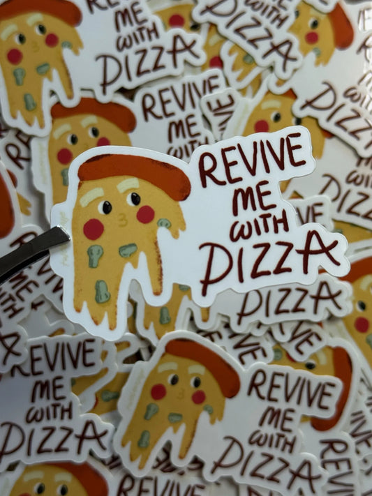 A pile of die-cut stickers featuring a cartoon pizza slice character wearing a red beret with the phrase 'REVIVE ME WITH PIZZA' in brown lettering on a white background.